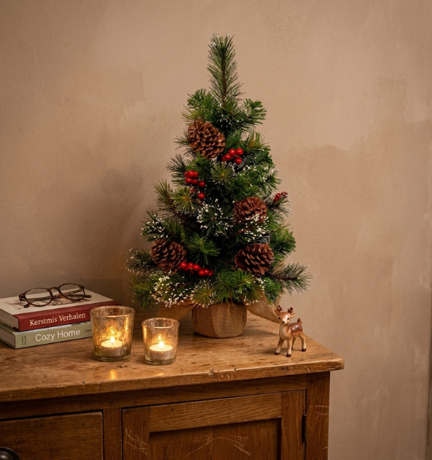 In een kleine woning kerst vieren: kleine kerstboom
